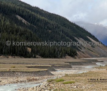 The Athabasca Glacier waters slowly flowing downhill from the Columbia Icefields to valley...Alberta