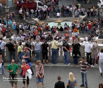 Again - close up into crowds gathered above  Piazza di Spagna seen from a sidewalk next to the Trinita dei Monti,  Rome