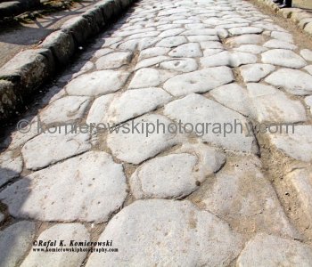 As you walk through the streets of Pompeii one of the most striking features of the city is the very deep grooves left on the paving stones.