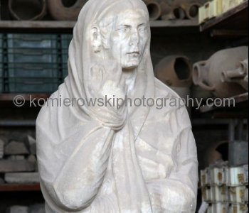 ( Vertical view) Plastered statue of woman  recreated from the times of ancient Pompeii