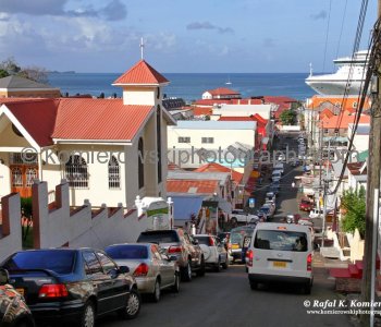 The city is surrounded by a hillside of an old volcano crater and is on a horseshoe-shaped harbour, population close to 89 thousand