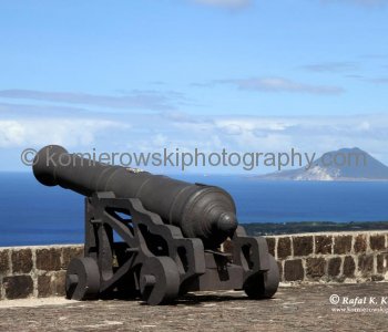 The walls of the structures are predominantly of stone, laboriously fashioned from the hard volcanic rock of which the hill is composed