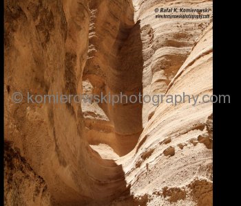 Water and, to a lesser extent, wind erosion preferentially attacks the moderately-indurated sand and ash grains around the base of large blocks in the gravel-rich beds