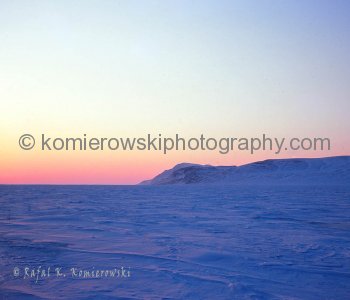 Canadian Arctic, Massey Sound, April 17, 1975, -43C.  Last time sun below horizon before a continuous 24 hours during Arctic Spring and Summer Months. Massey Sound between Haig-Thomas Island, Amund Rignes Island and Axel Heiberg Island. 78 degrees, 41 min