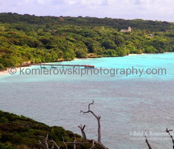 Lifou.....many limestone caves and  white beaches with coral reefs are teeming with brightly coloured marine... life