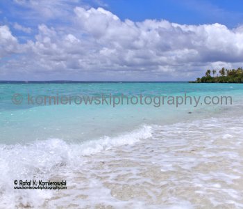 Lifou.....many limestone caves and  white beaches with coral reefs are teeming with brightly coloured marine... life