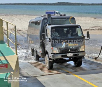 Entering ferry to Fraser Island...Four-wheel-driving on Fraser Island can be dangerous...Rule No. 1 is...do not drive along the foredunes to avoid the high tides because vehicle can subside in the softer sands because unstable and roll-over causing seriou